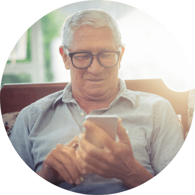 an elderly man texting