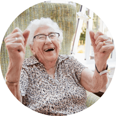an elderly woman celebrating