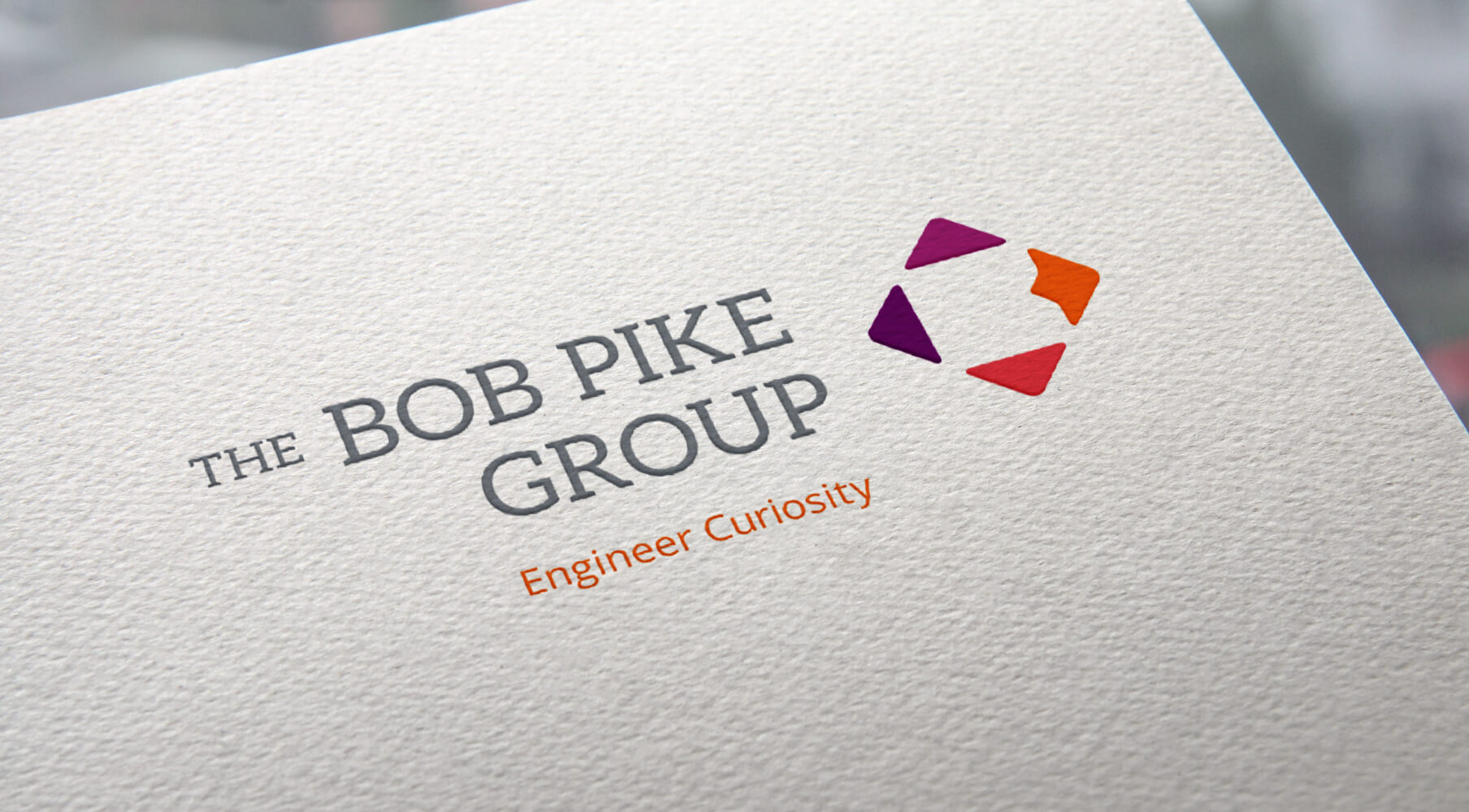 the bob pike group logo on a letter